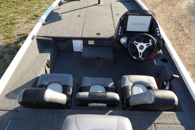 Slide: The Image of 2025 Crestliner XF 189 boat interior with Garmin dashboard and three cushioned seats. - 17