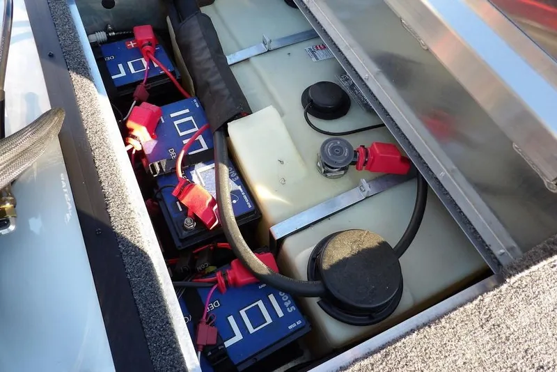 Slide: The Image of 2025 Crestliner XF 189 boat battery compartment with wiring and connections. - 18