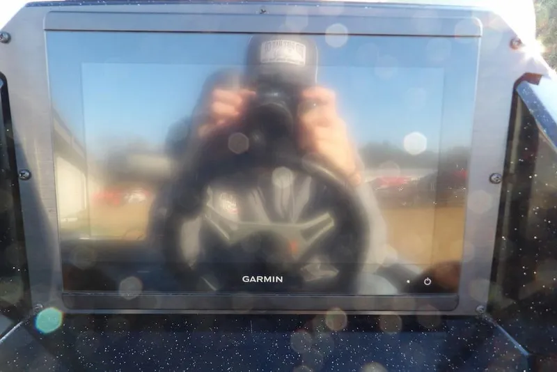 Slide: The Image of Reflection on Garmin screen in 2025 Crestliner XF 189 boat cockpit. - 22