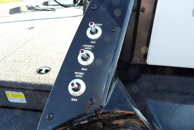 Slide: The Image of Control panel of 2025 Crestliner XF 189 boat with labeled switches. - 23