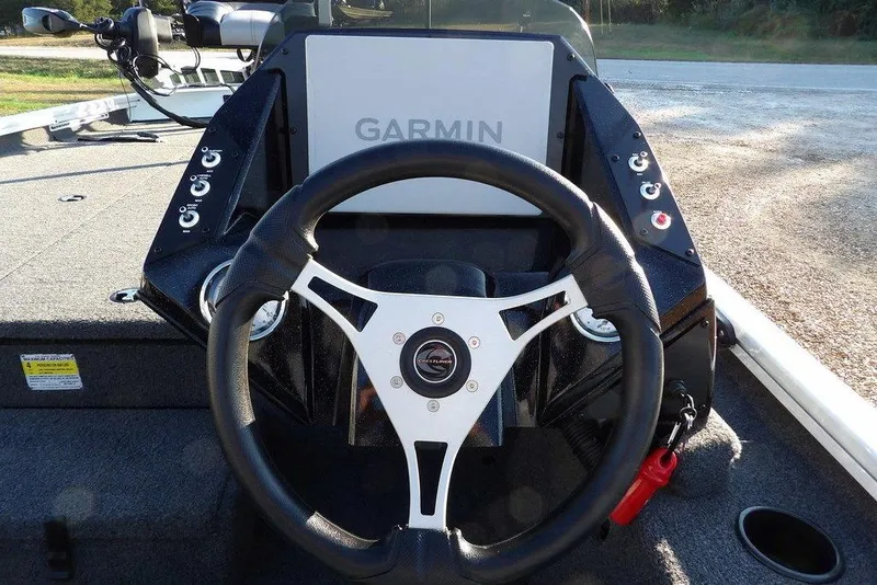 Slide: The Image of 2025 Crestliner XF 189 boat dashboard with Garmin display and steering wheel. - 24