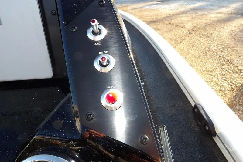 Slide: The Image of Control panel of 2025 Crestliner XF 189 boat with switches for ANC, bilge, and horn. - 25