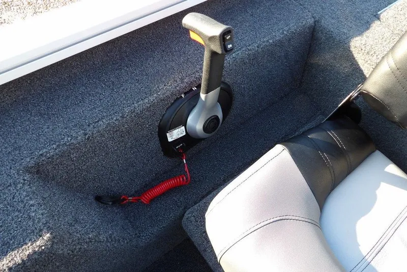 Slide: The Image of 2025 Crestliner XF 189 boat interior with control lever and seat detail. - 27