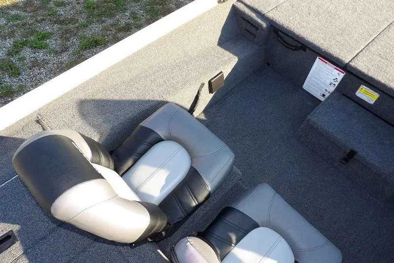 Slide: The Image of 2025 Crestliner XF 189 boat interior with dual seats and carpeted flooring. - 29