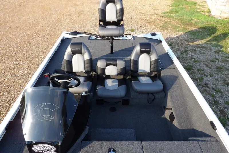 Slide: The Image of 2025 Crestliner XF 189 boat interior with three seats and steering console. - 32