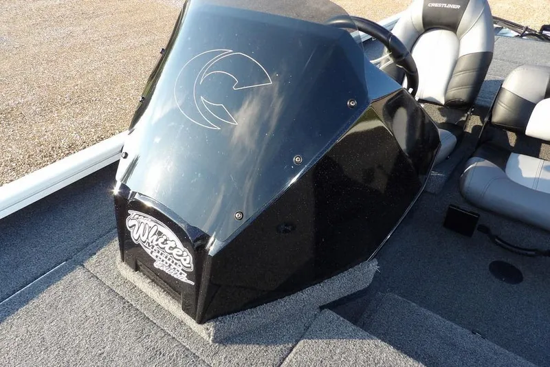 Slide: The Image of 2025 Crestliner XF 189 boat console with steering wheel and seating. - 33