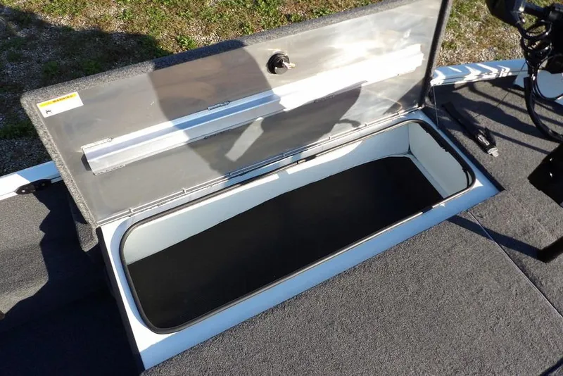 Slide: The Image of Open storage compartment on 2025 Crestliner XF 189 boat deck. - 36