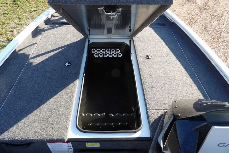 Slide: The Image of 2025 Crestliner XF 189 boat with open storage compartment, showcasing interior rod holders. - 37