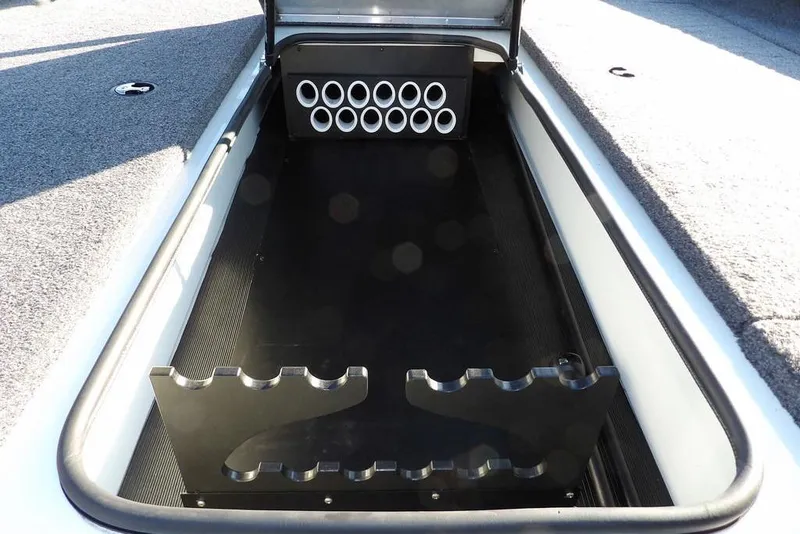 Slide: The Image of 2025 Crestliner XF 189 boat storage compartment with rod holders and organized layout. - 39