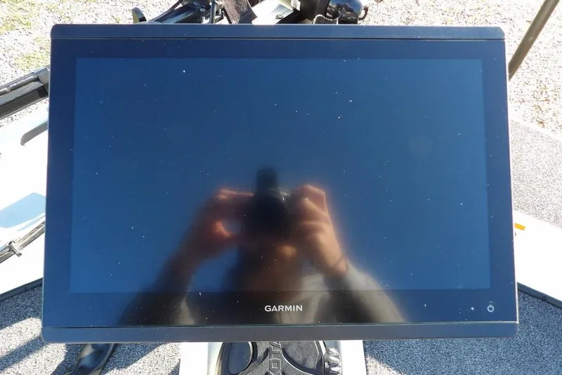 Slide: The Image of Garmin display on 2025 Crestliner XF 189 boat, reflecting sunlight. - 42