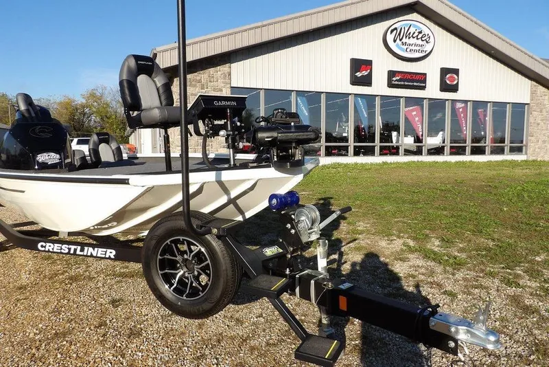 Slide: The Image of 2025 Crestliner XF 189 boat on trailer outside White's Marine Center. - 43