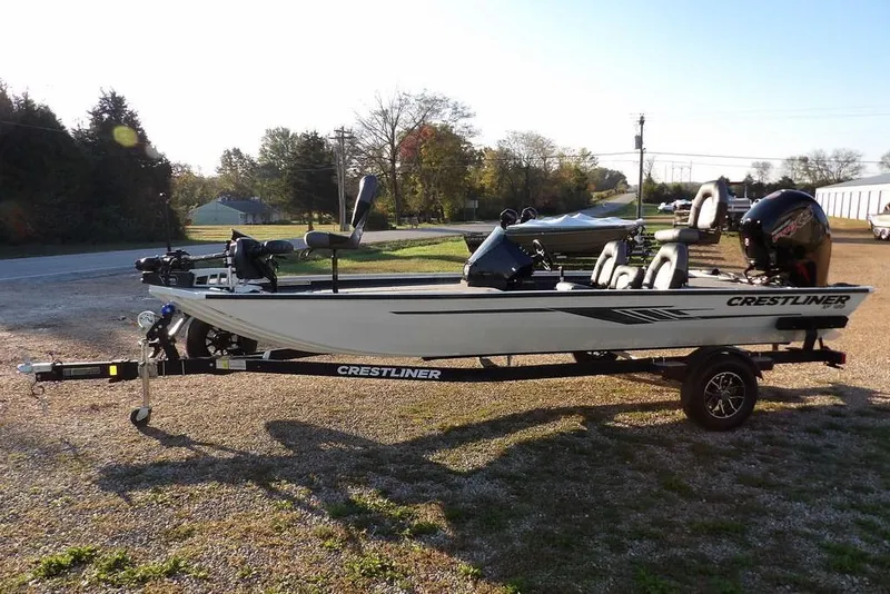 Slide: The Image of 2025 Crestliner XF 189 fishing boat on trailer, parked outdoors. - 7