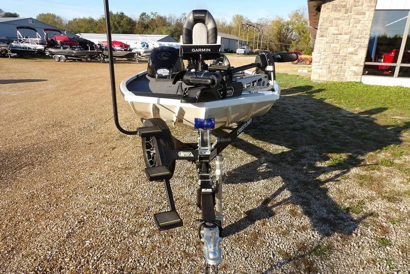 Slide: The Image of 2025 Crestliner XF 189 boat on trailer, equipped with Garmin technology, parked outdoors. - 8
