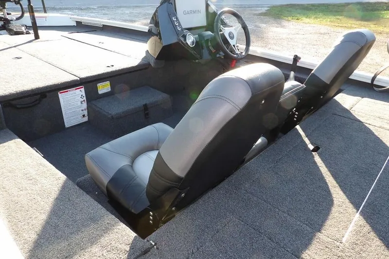 Slide: The Image of 2025 Crestliner XF 189 boat interior with dual seats and steering console. - 9