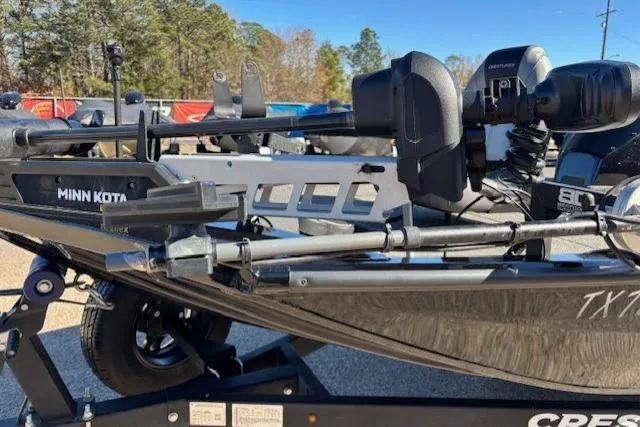 Slide: The Image of 2023 Crestliner XFC 189 boat with Minn Kota trolling motor, parked outdoors. - 10