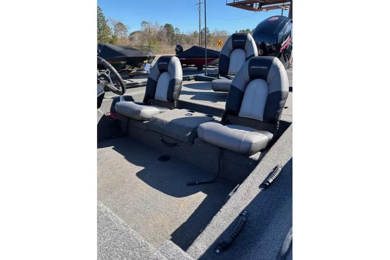 Slide: The Image of 2023 Crestliner XFC 189 boat interior with dual seats and steering wheel. - 12