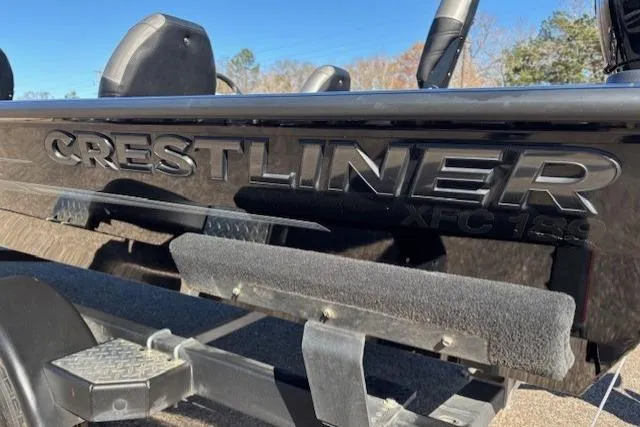 Slide: The Image of 2023 Crestliner XFC 189 boat on trailer, showcasing sleek black exterior design. - 13