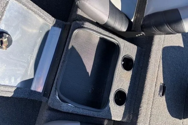 Slide: The Image of 2023 Crestliner XFC 189 boat interior with storage compartment and cup holders. - 18