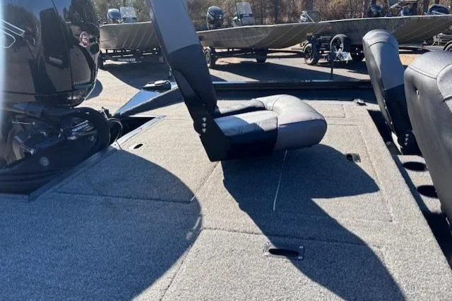 Slide: The Image of 2023 Crestliner XFC 189 boat interior with seating and motor, showcasing spacious design. - 5