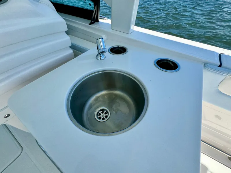 Slide: The Image of Stainless steel sink on 2025 Robalo R257 Dual Console boat. - 26