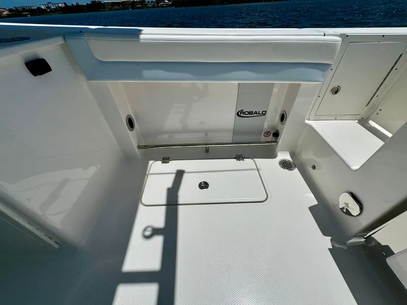 Slide: The Image of 2025 Robalo R257 Dual Console boat interior with storage compartments and sleek design. - 27