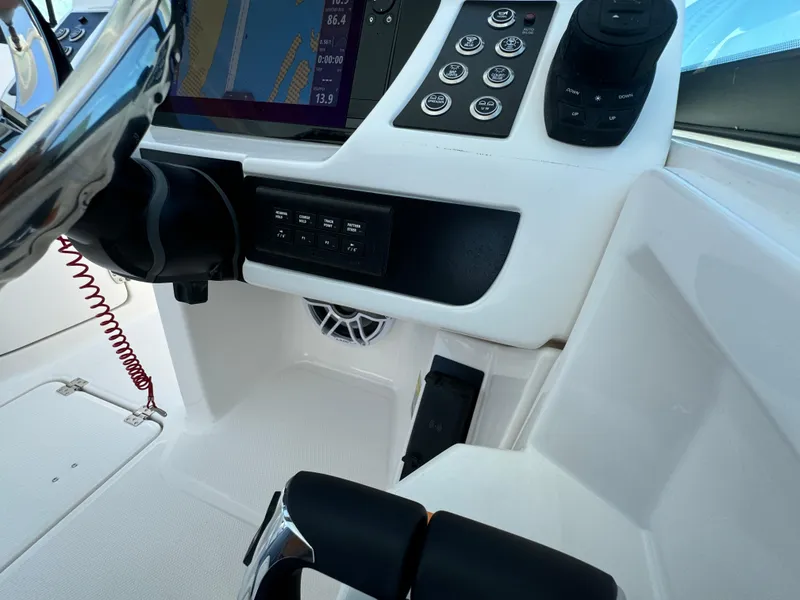 Slide: The Image of 2025 Robalo R257 Dual Console dashboard with steering wheel and control panel. - 40