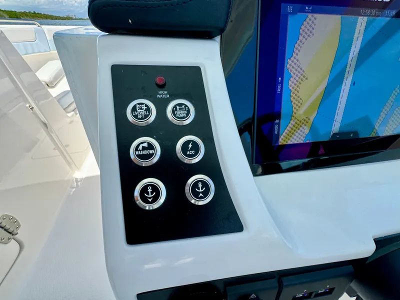 Slide: The Image of Control panel of 2025 Robalo R257 Dual Console boat with navigation display. - 42