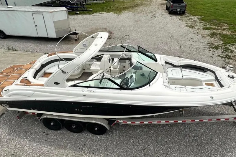 Slide: The Image of 2007 Sea Ray 290 SLX boat on trailer, featuring sleek design and spacious seating. - 10