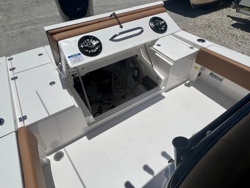 Slide: The Image of Robalo 266 Cayman 2025 boat with open storage and speakers. - 13