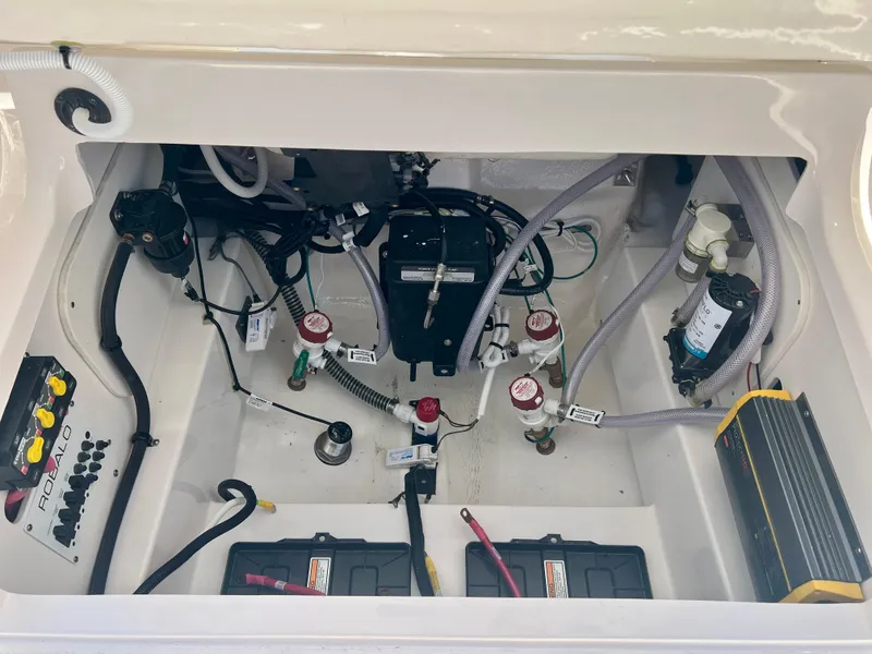 Slide: The Image of Interior view of a 2025 Robalo 266 Cayman engine compartment. - 14
