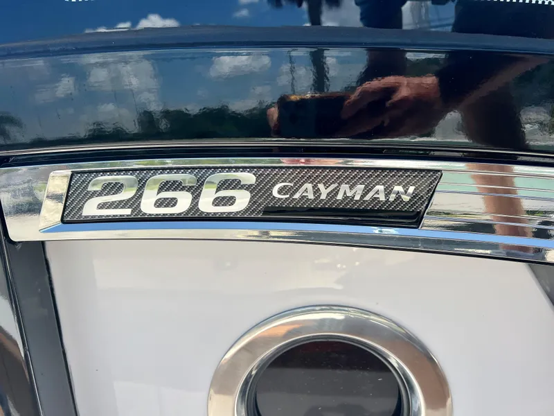 Slide: The Image of Close-up of 2025 Robalo 266 Cayman boat emblem. - 26