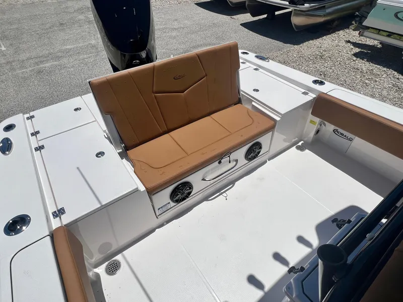 Slide: The Image of 2025 Robalo 266 Cayman with brown seating and speakers. - 9