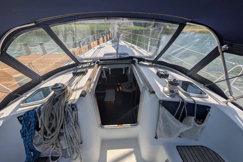 Slide: The Image of Cockpit view of 1999 Beneteau Oceanis 361 sailboat, featuring ropes and winches. - 14