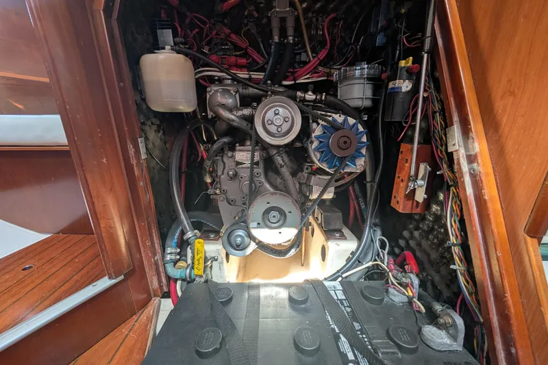 Slide: The Image of Engine compartment of a 1999 Beneteau Oceanis 361 sailboat, showcasing mechanical components. - 29