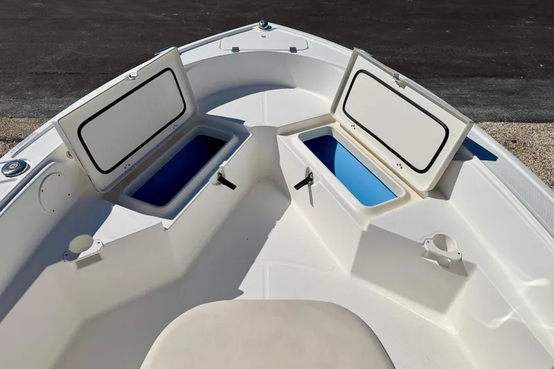 Slide: The Image of 2014 Mako 184 Center Console boat with open storage compartments. - 10