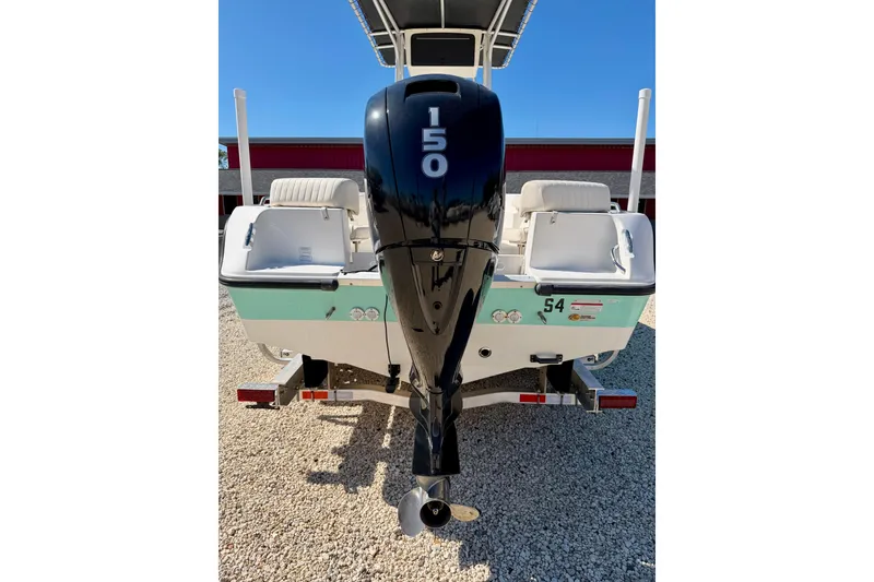 Slide: The Image of 2014 Mako 184 Center Console boat with 150 HP outboard motor, rear view. - 23