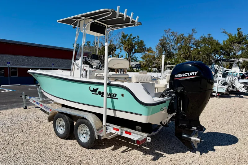 Slide: The Image of 2014 Mako 184 Center Console boat with Mercury engine on trailer, parked outdoors. - 7