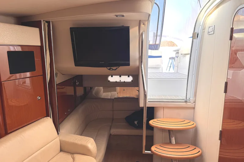 Slide: The Image of Interior of 2011 Formula 34 Performance Cruiser with TV, leather seating, and wooden accents. - 10