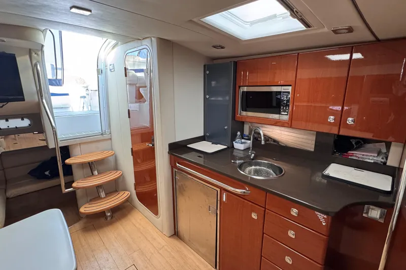 Slide: The Image of Luxurious interior of 2011 Formula 34 Performance Cruiser with modern kitchen amenities. - 11