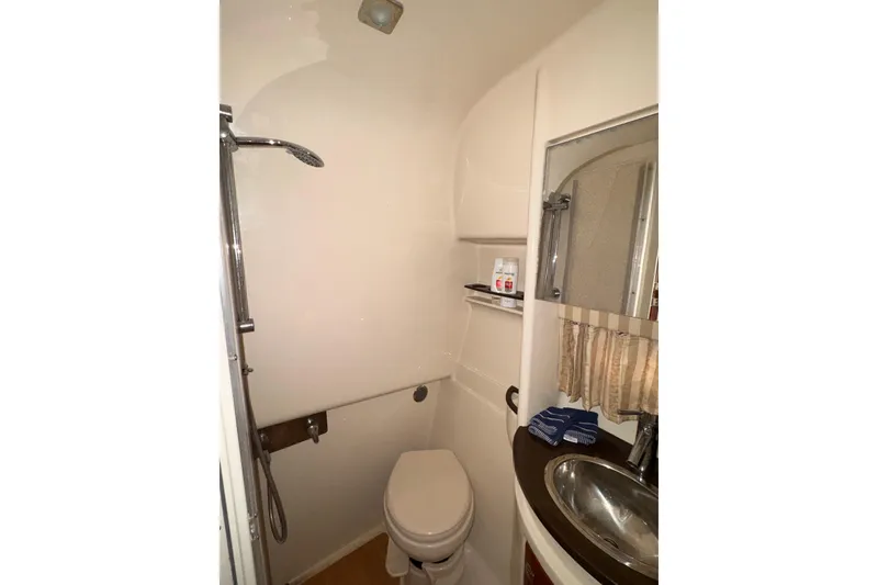 Slide: The Image of Bathroom interior of 2011 Formula 34 Performance Cruiser with shower and sink. - 13