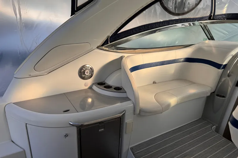 Slide: The Image of 2011 Formula 34 Performance Cruiser interior with white seating and blue accents. - 18