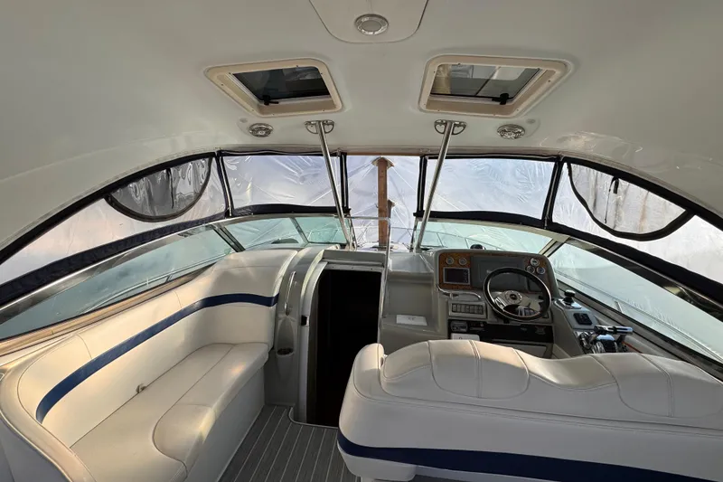 Slide: The Image of Interior of a 2011 Formula 34 Performance Cruiser with helm and seating area. - 19