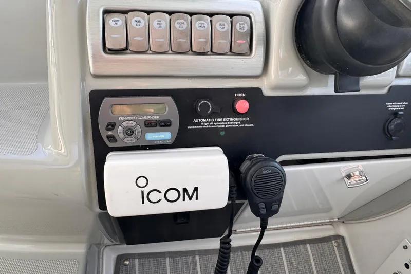 Slide: The Image of Control panel of a 2011 Formula 34 Performance Cruiser with Icom and Kenwood devices. - 23