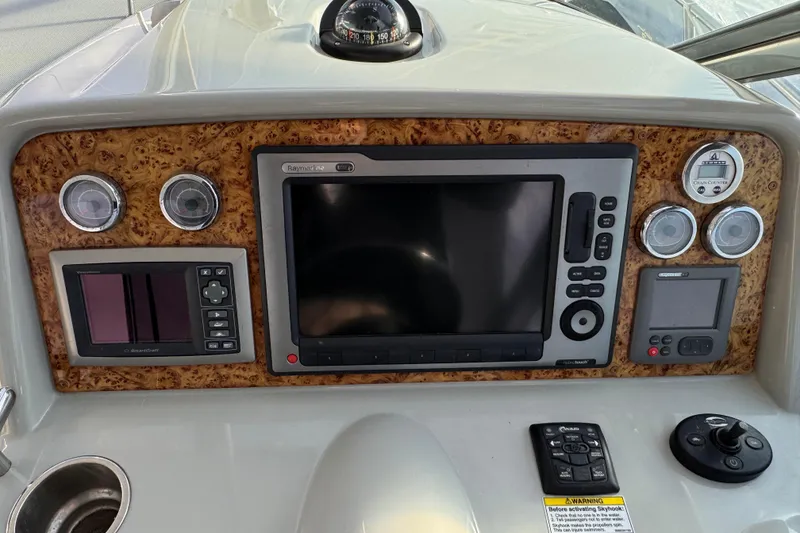 Slide: The Image of 2011 Formula 34 Performance Cruiser dashboard with navigation and control instruments. - 24