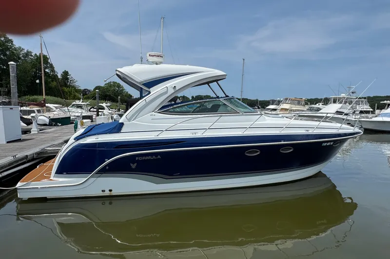 Slide: The Image of 2011 Formula 34 Performance Cruiser docked at marina, side view. - 3