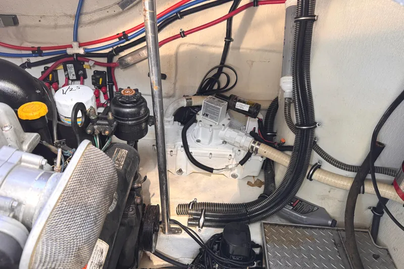 Slide: The Image of Engine compartment of a 2011 Formula 34 Performance Cruiser with visible wiring and components. - 30