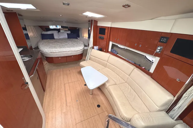 Slide: The Image of Luxurious interior of a 2011 Formula 34 Performance Cruiser with modern amenities and elegant design. - 4