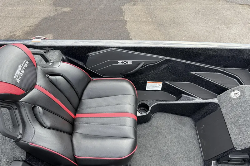 Slide: The Image of 2026 Skeeter ZXE20 boat interior with black and red seating, sleek design. - 12