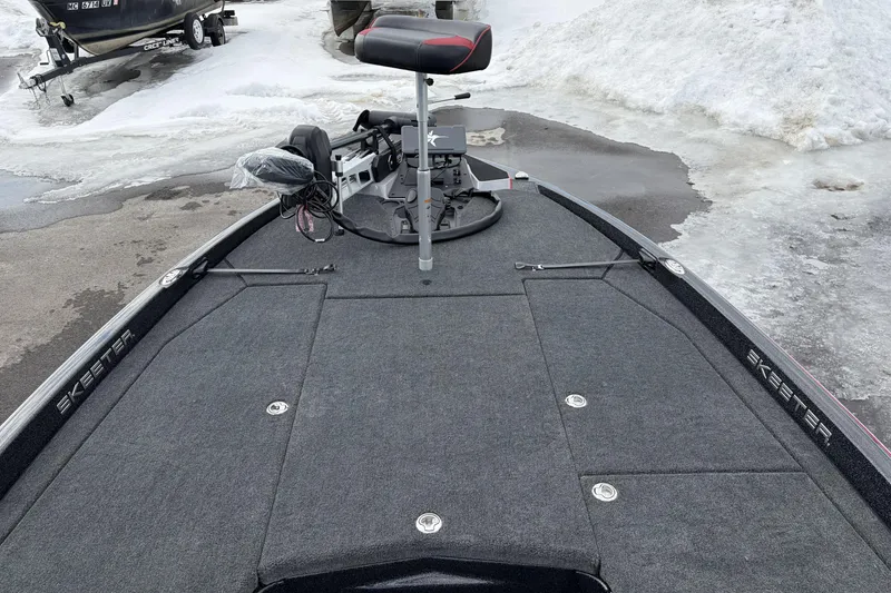 Slide: The Image of 2026 Skeeter ZXE20 boat on snowy ground, featuring a sleek deck and seating. - 14