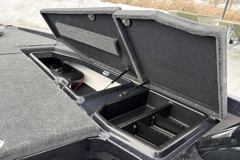 Slide: The Image of 2026 Skeeter ZXE20 boat storage compartments open, showcasing interior design and functionality. - 16